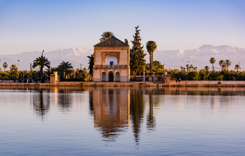 Saadian pavilion,Menara gardens and Atlas in Marrakech, Morocco, Africa at sunset. Water reflection.